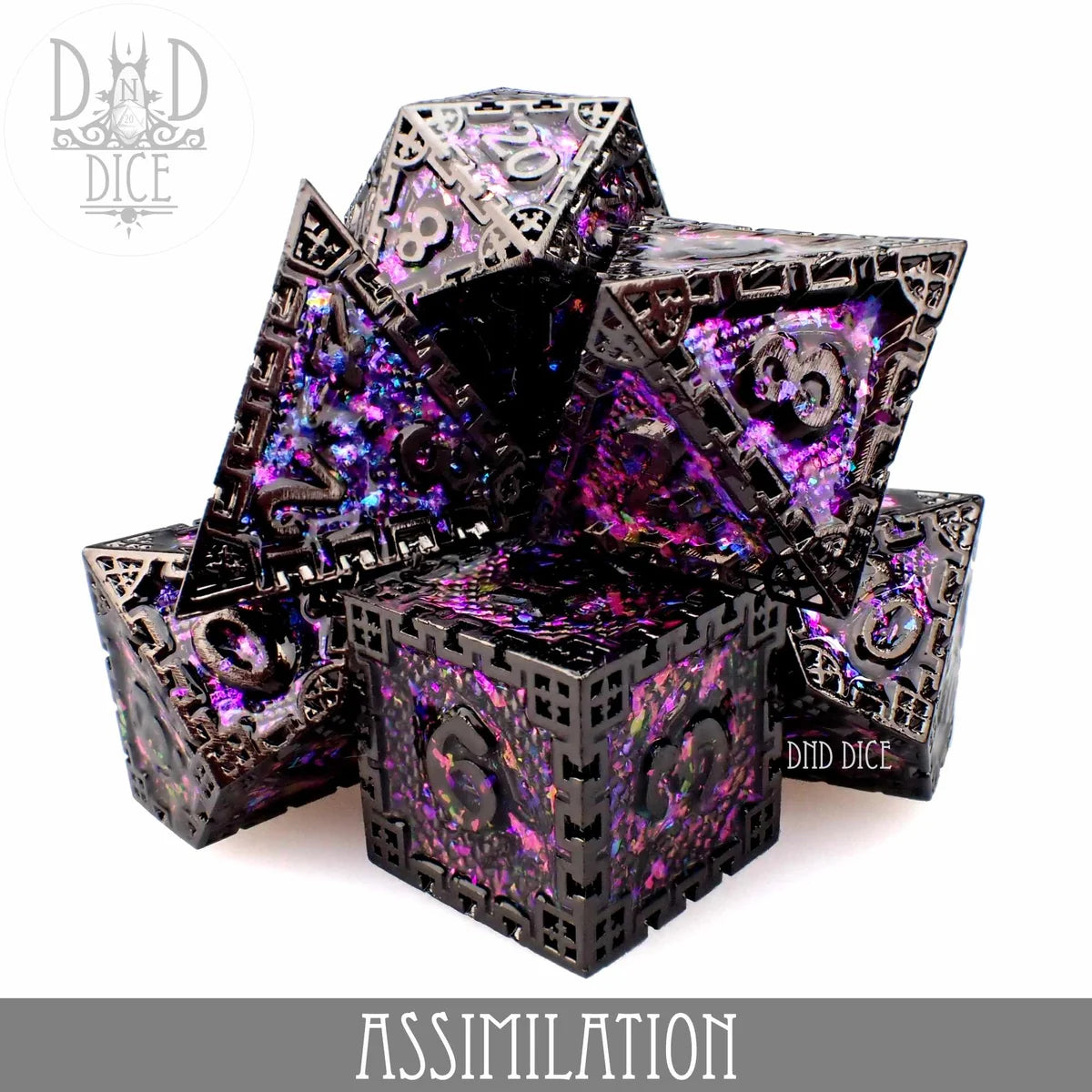 Assimilation metal dice set with a dark geometric cage over a cosmic purple and pink core