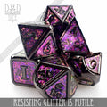 Resisting Glitter is Futile metal dice set with dark metal frames filled with purple and pink glitter enamel