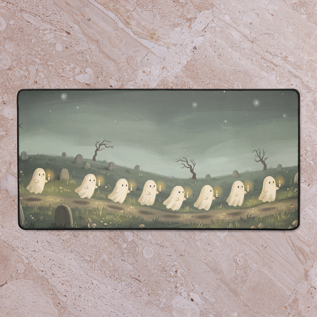 Little Ghost Candle Parade 16x32 inch playmat shown on a tabletop