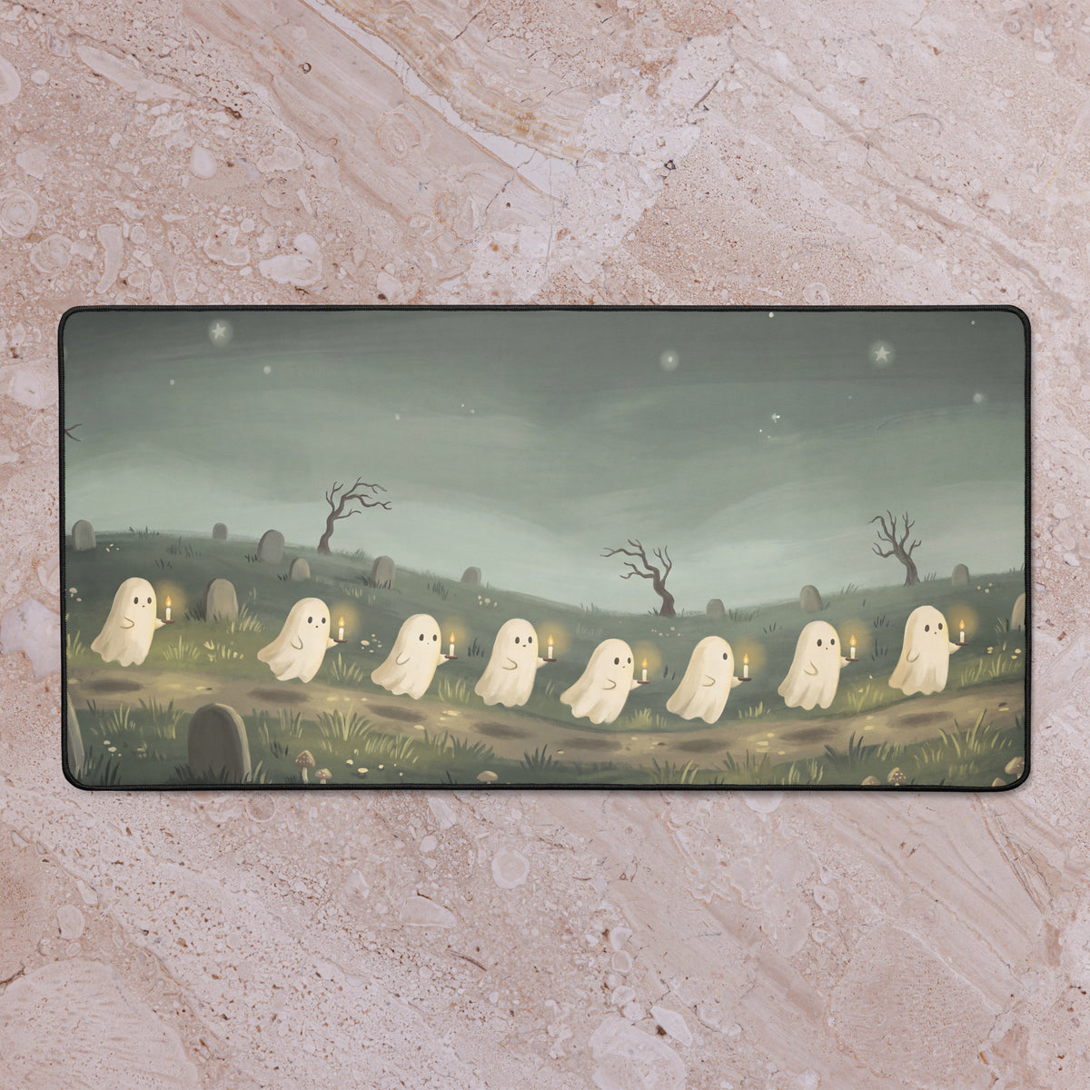 Little Ghost Candle Parade 16x32 inch playmat shown on a tabletop