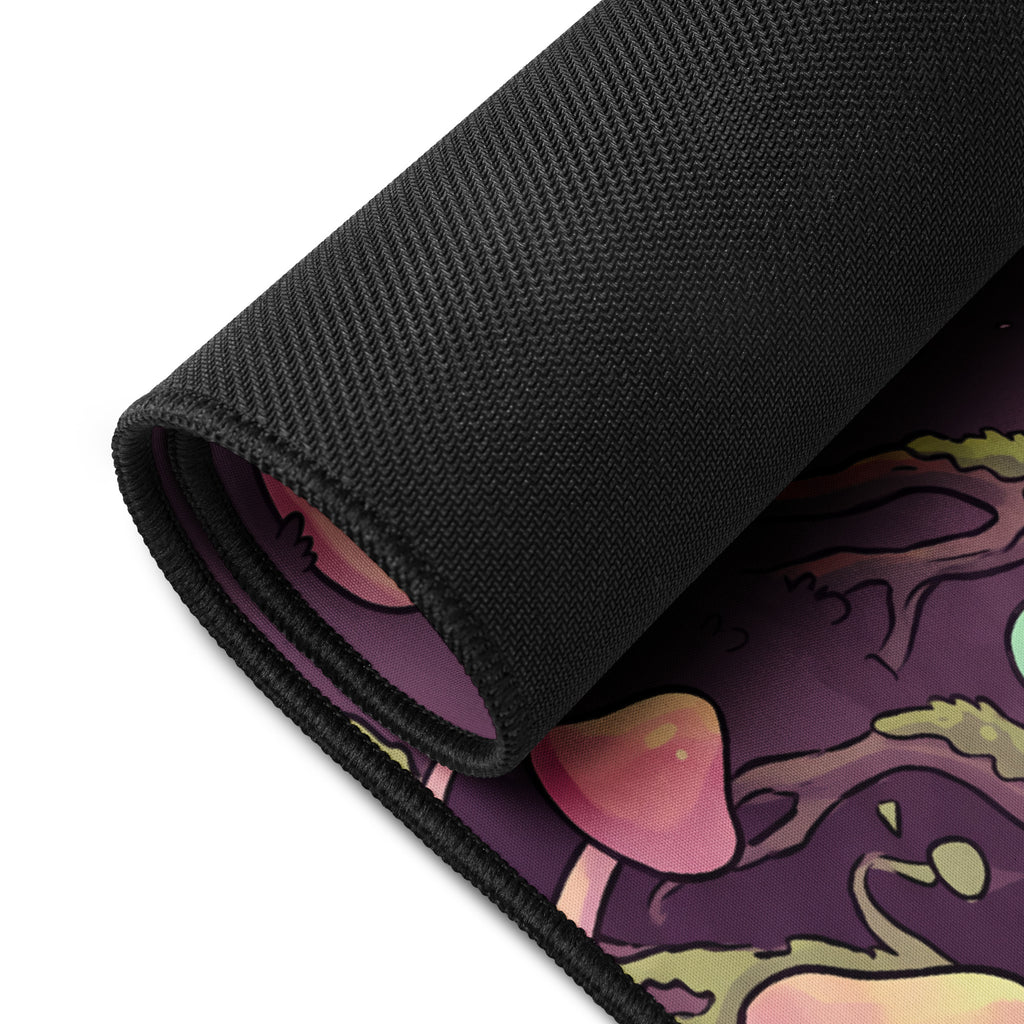 Mushroom Hollow Mischief 16x32 inch playmat, rolled corner showing the black rubber base